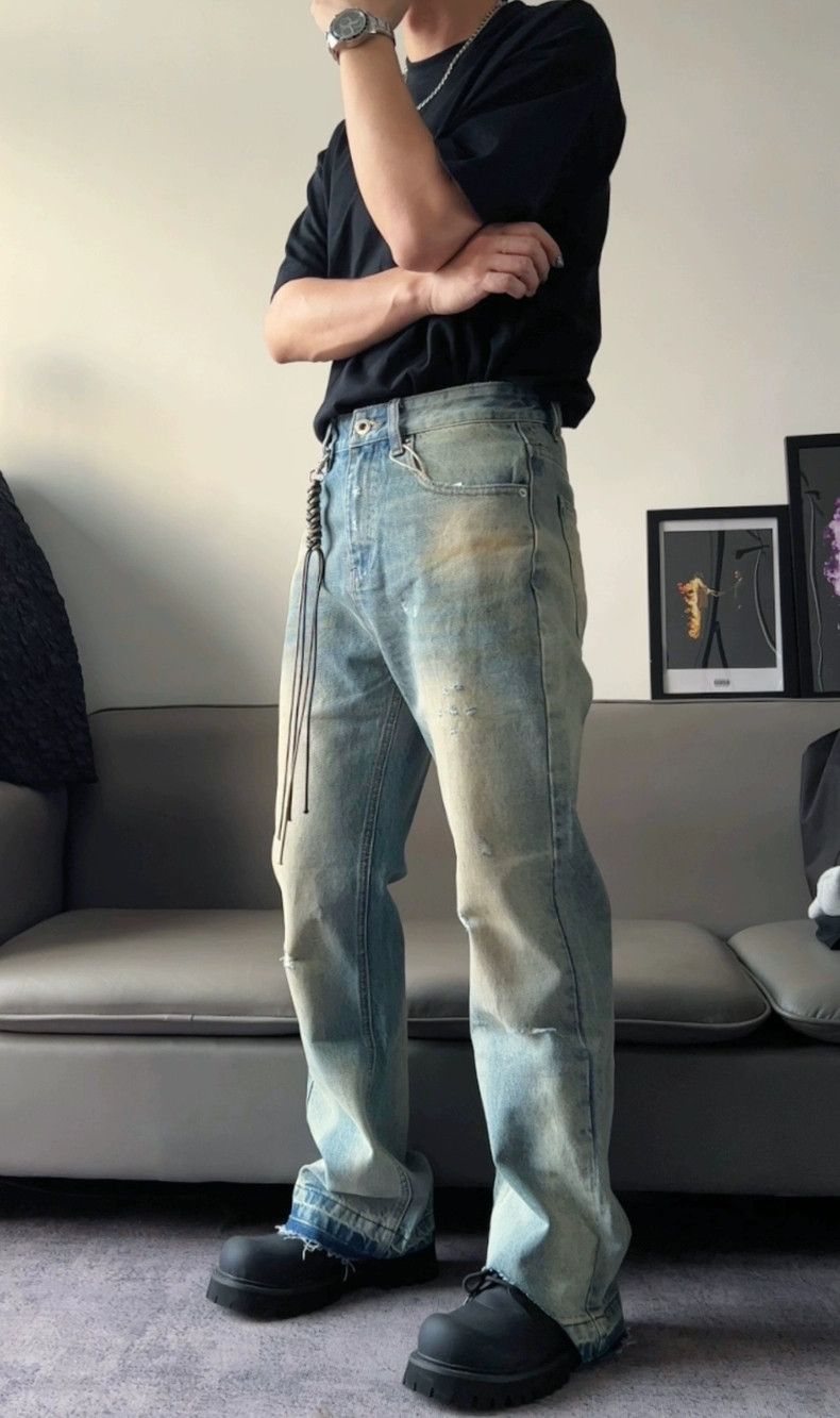 dirty washed damaged bootcut jeans