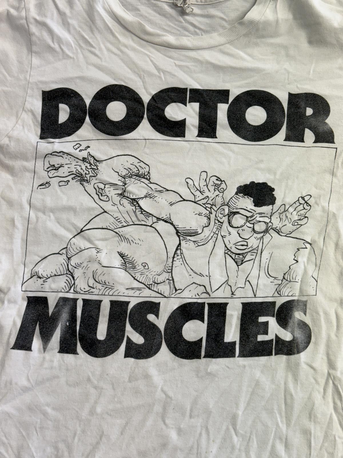Anvil Thrashed Doctor Muscles Comic Strip T-shirt Fist Head Size US S / EU 44-46 / 1 - 4 Thumbnail