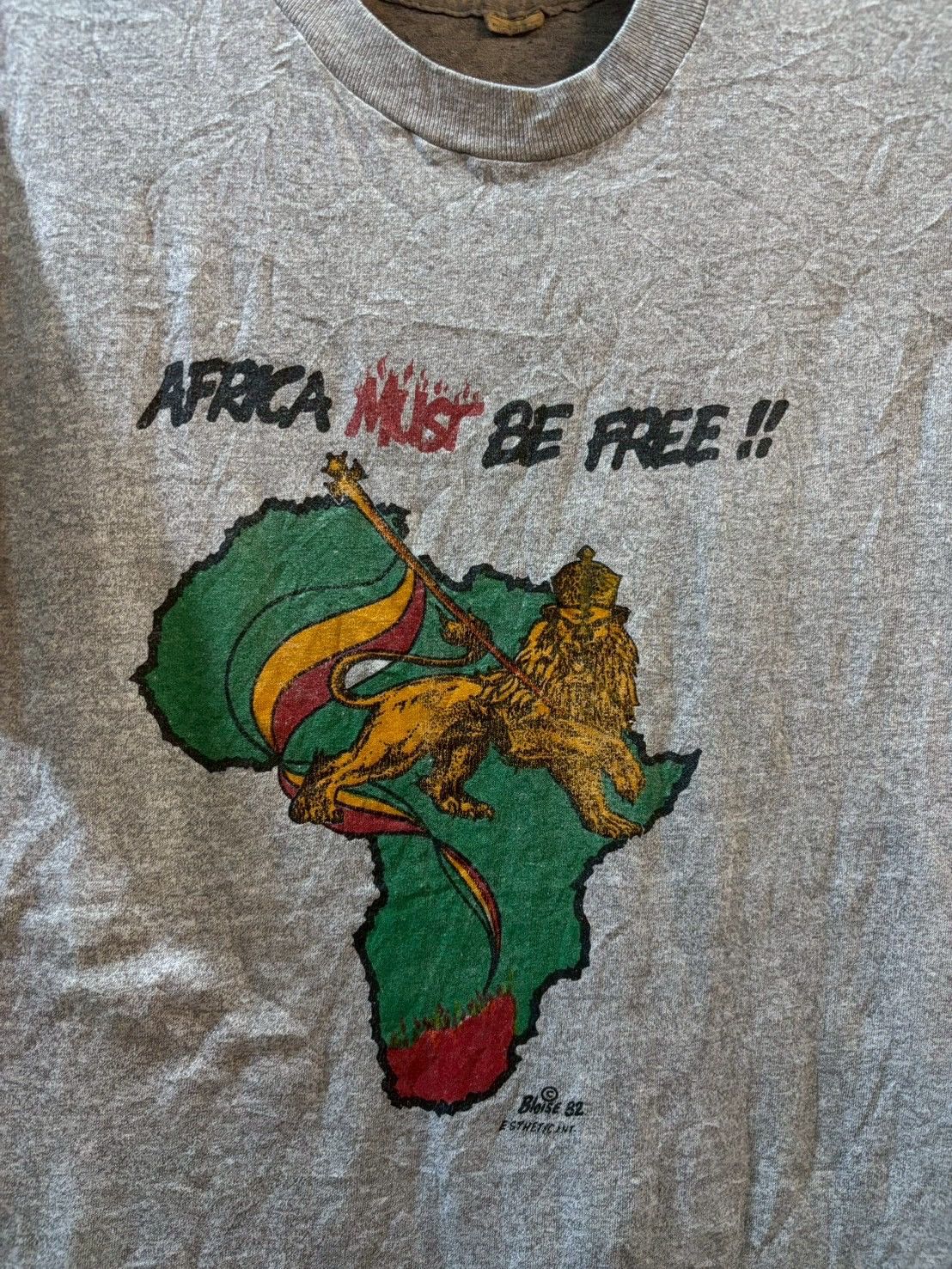 Band Tees Africa Must be free 1982’s Size US M / EU 48-50 / 2 - 3 Thumbnail