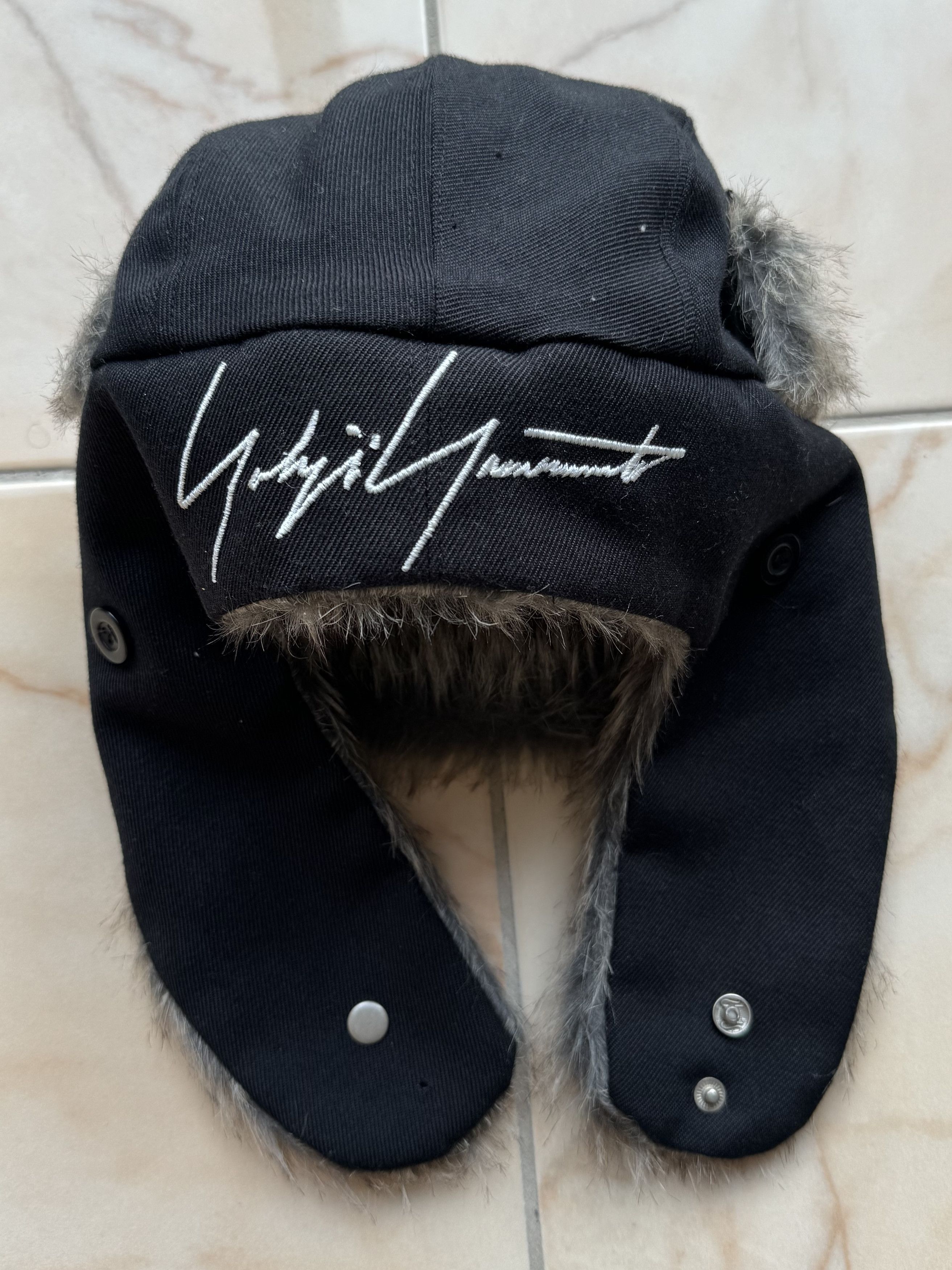 Yohji Yamamoto Yohji Yamamoto x New Era Embroidered Trapper Hat in Black |  Grailed