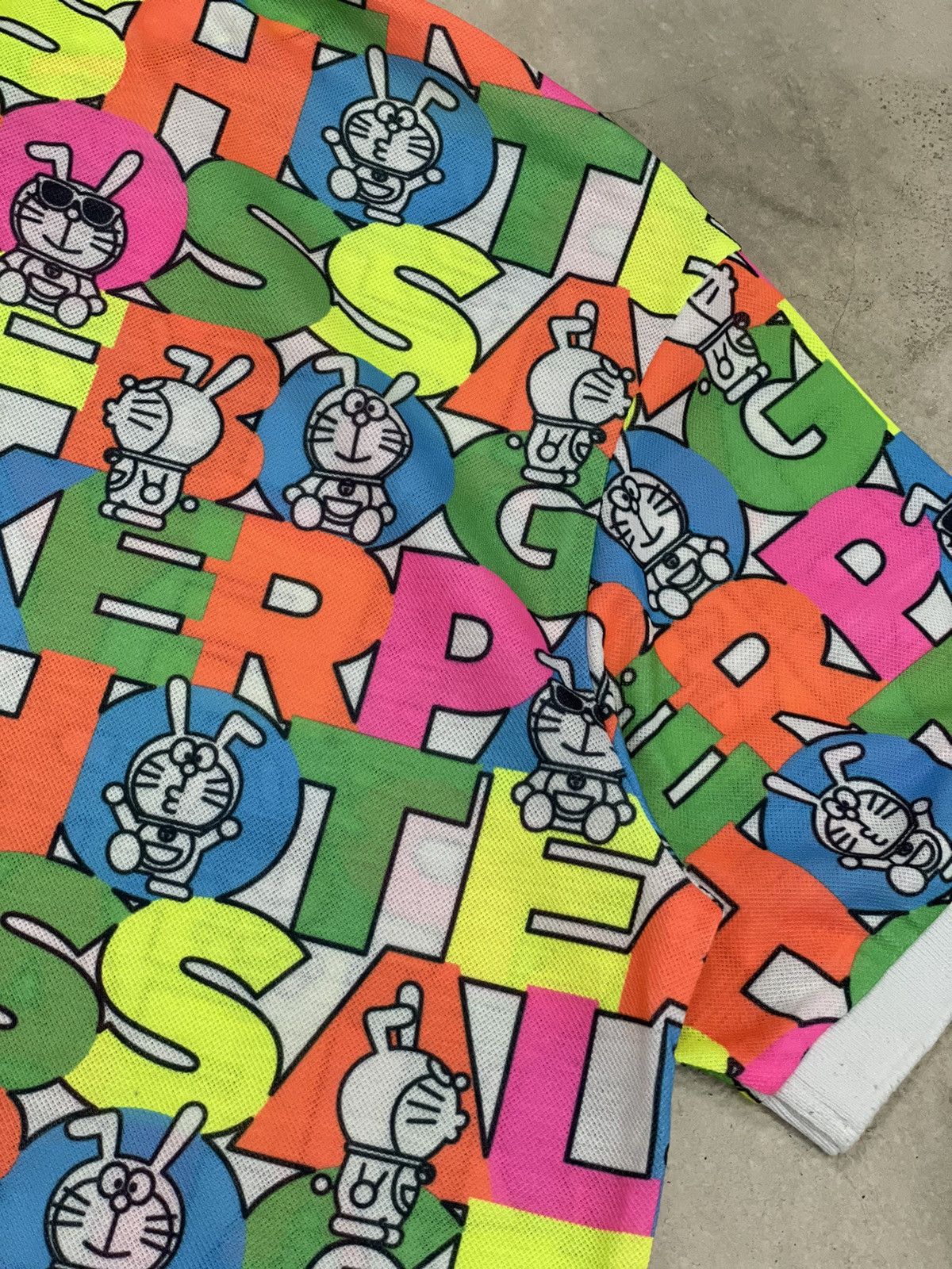 Anime × Japanese Brand × Psycho Bunny Jack Bunny Doraemon Polo Fullprint Wording Colorful Size US L / EU 52-54 / 3 - 11 Thumbnail