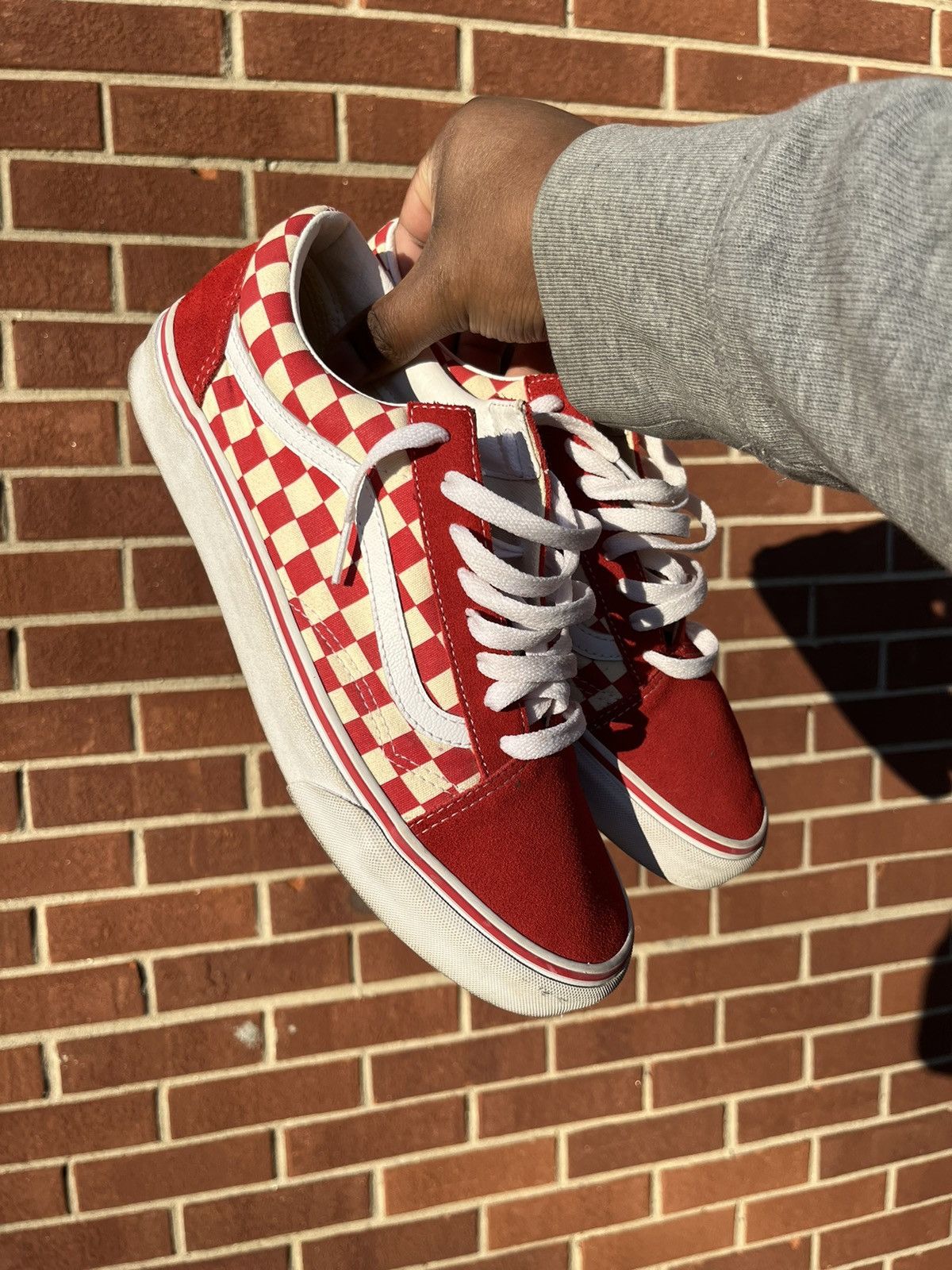 Red low top checkered vans deals