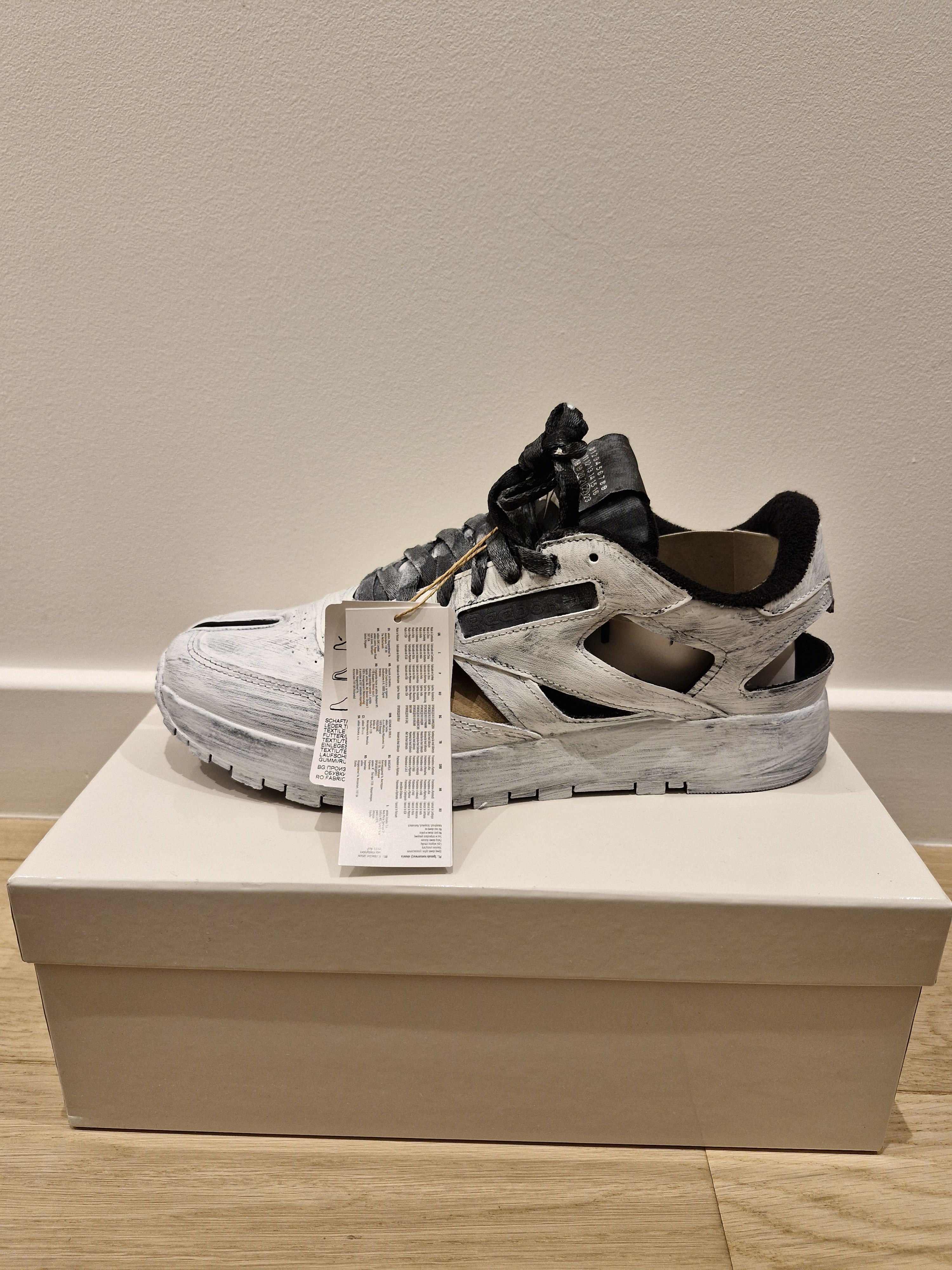 Maison Margiela  Reebok White painted Tabi sneakers | Grailed