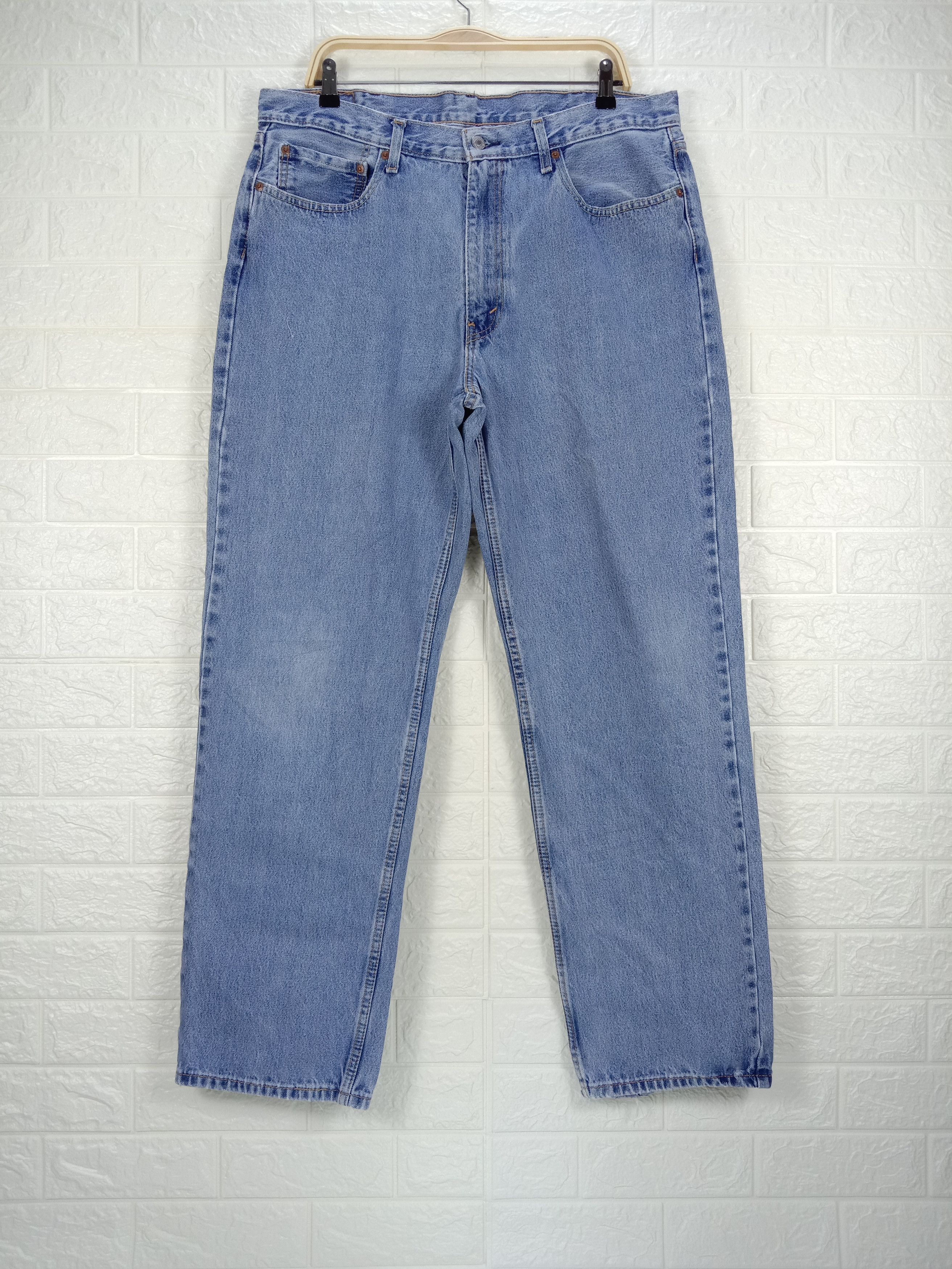 image of Vintage Levi's 550 Jeans Relaxed Fit Distressed Denim in Blue, Men's (Size 37)