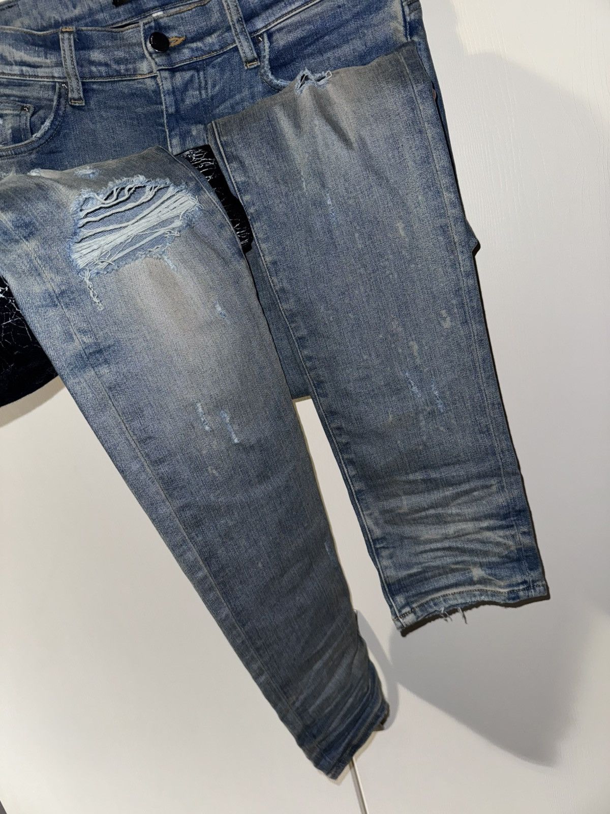 AMIRI BLUE DISTRESSED JEANS