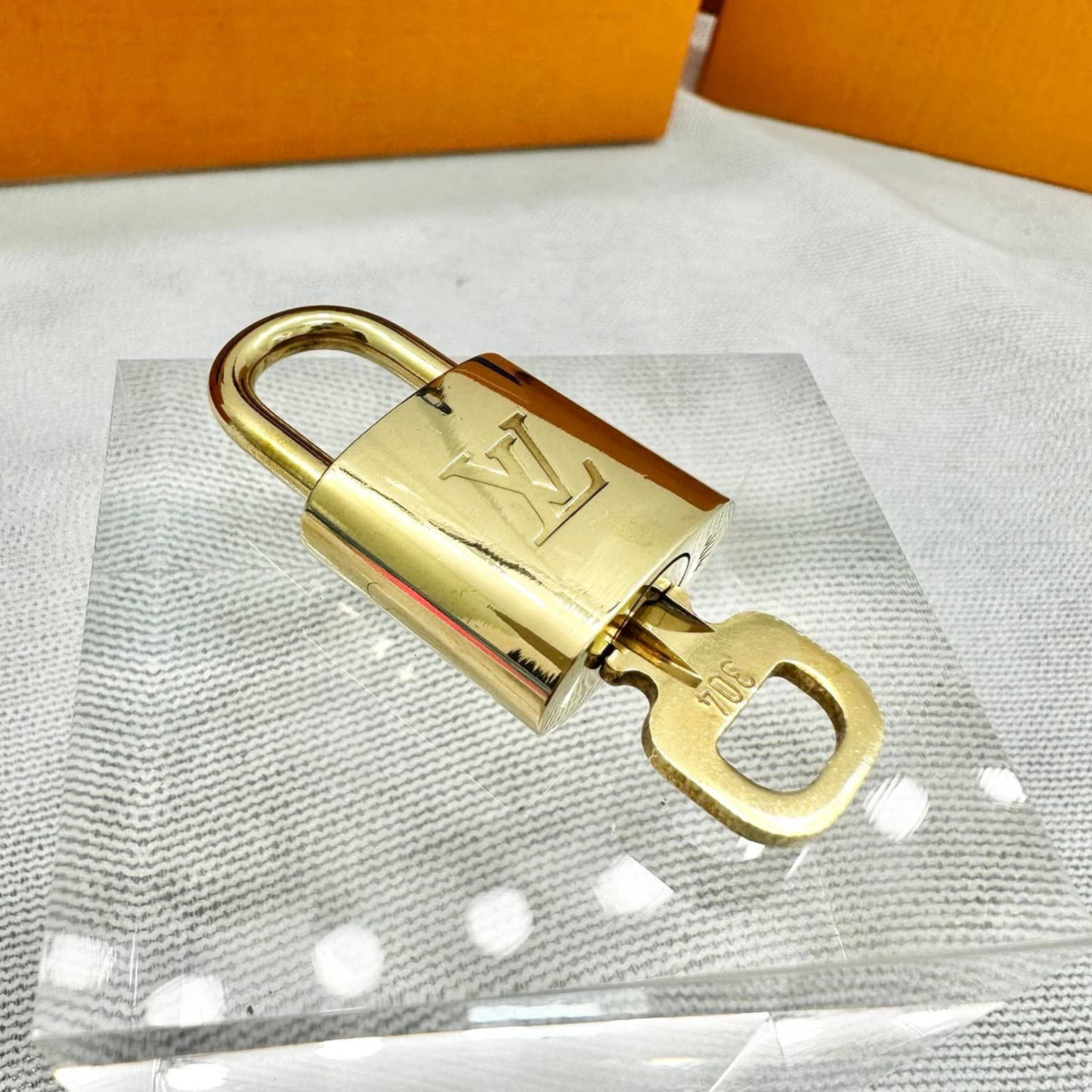 Louis Vuitton Gold Brass Lock and Key buy #304