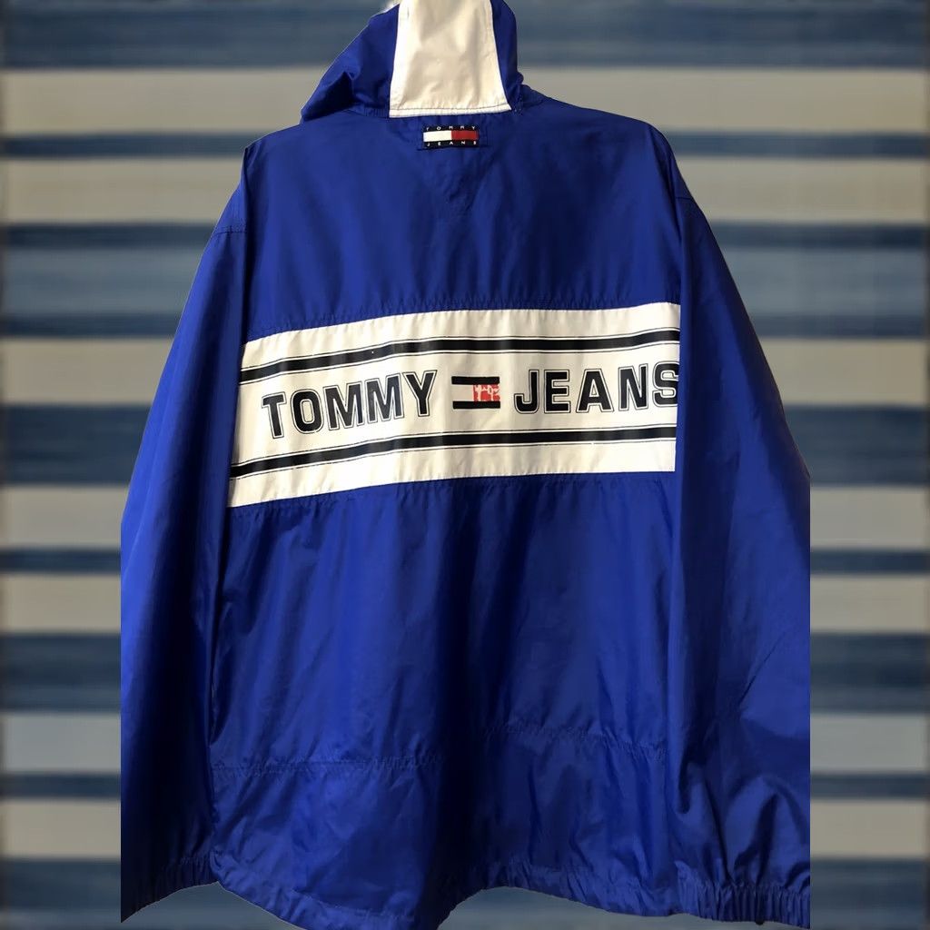 Tommy Hilfiger VTG Tommy Hilfiger Jeans Spell Out Flag Logo Windbreaker Hooded Jacket L Men Blue 90s Logo Size US 33 - 1 Thumbnail