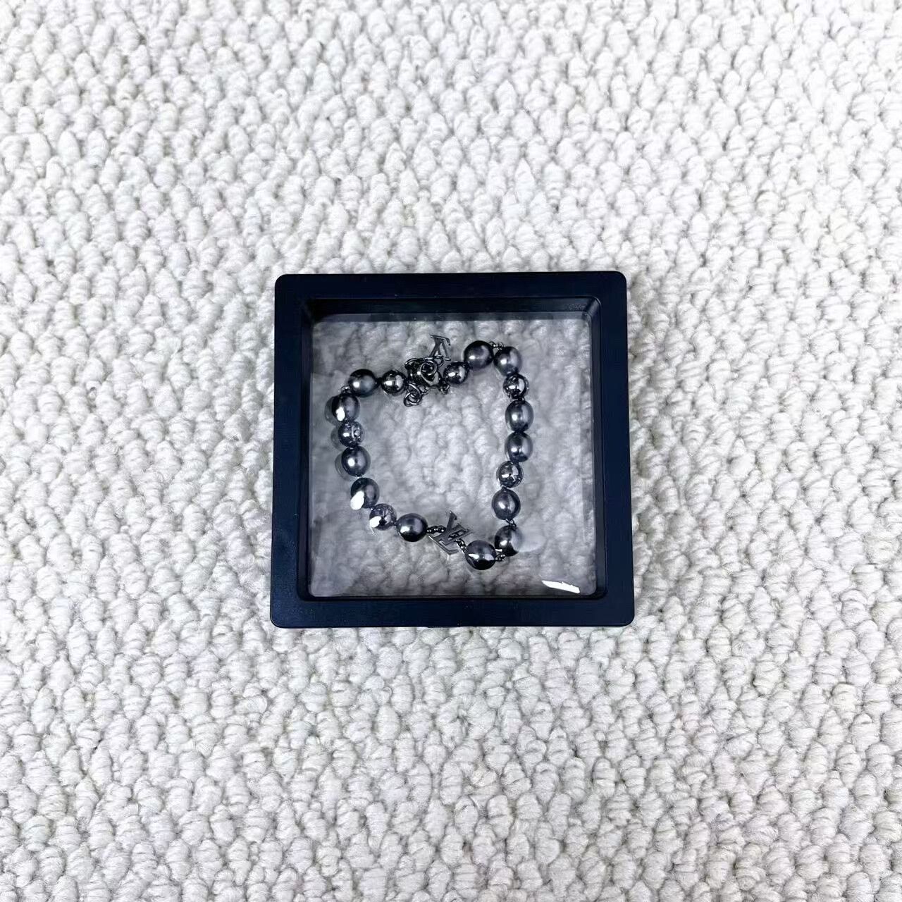 louis vuitton gray silver beaded bracelet
