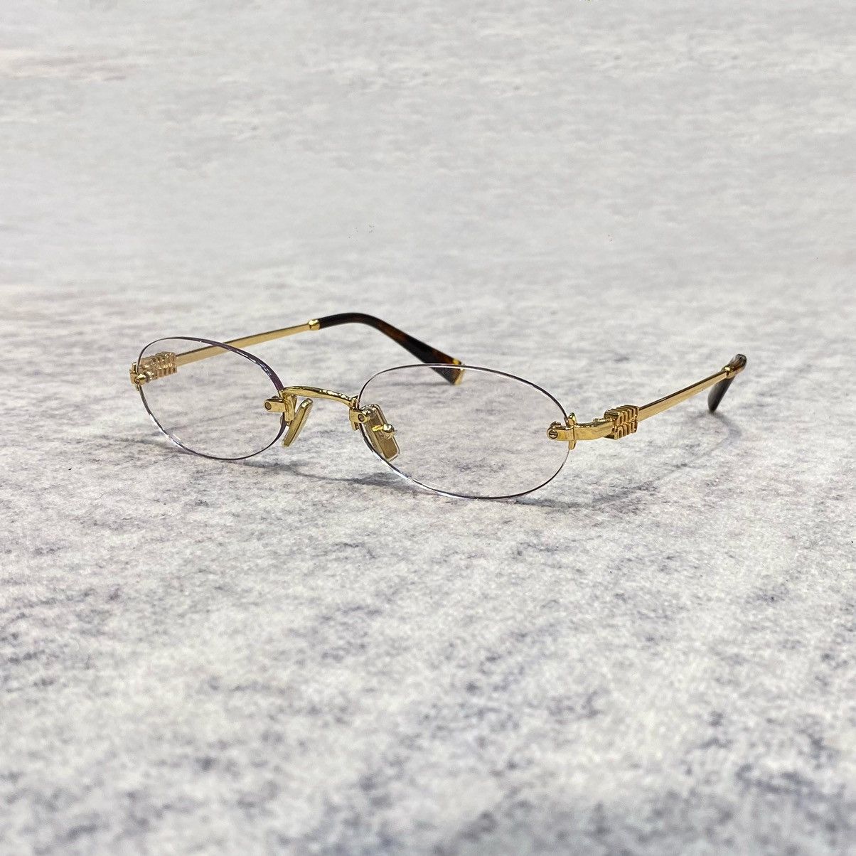 Miu Miu MIU MIU 0MU A54S 5AK08N GOLD | Grailed