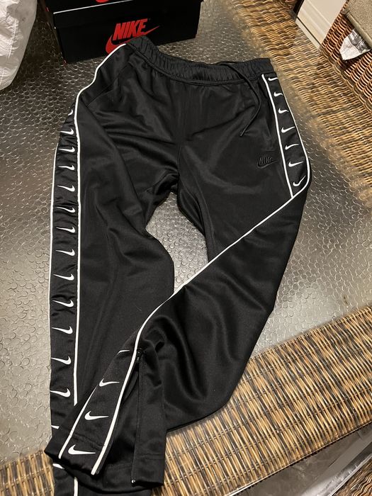 Nike tape best sale track pants black