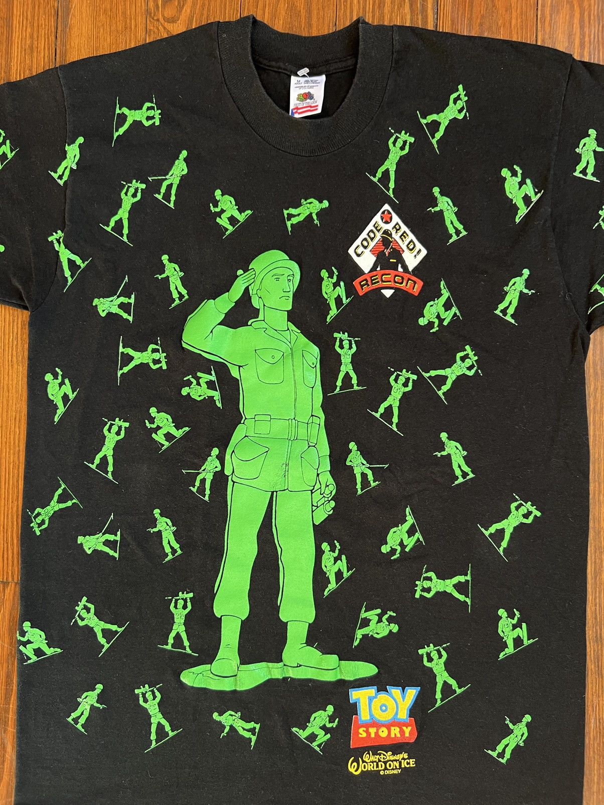 image of Vintage Disney Toy Story Green Army Men Aop Movie Tee in Black (Size Medium)