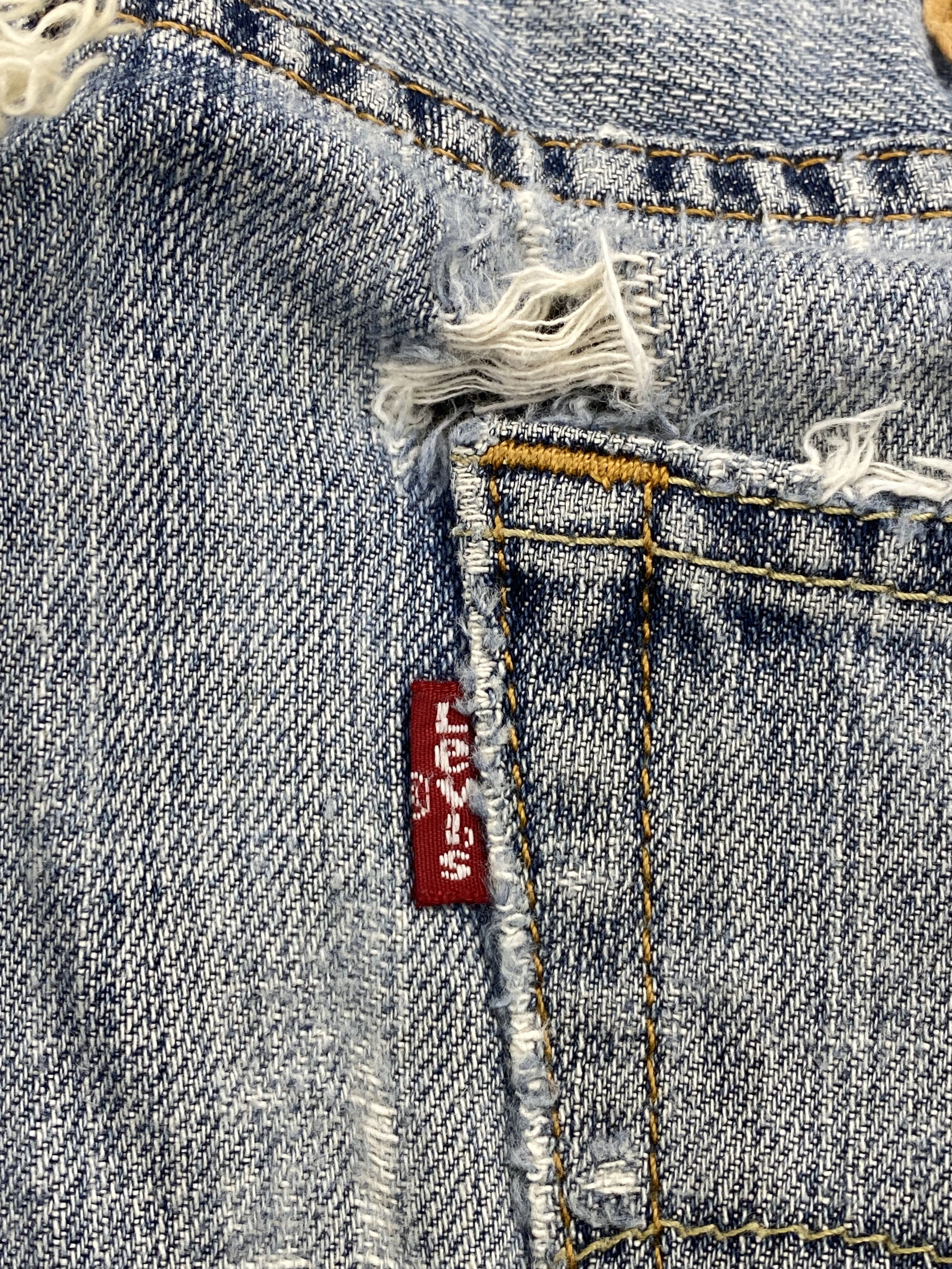 Distressed Vintage Levi's 505 Faded Blue Jeans