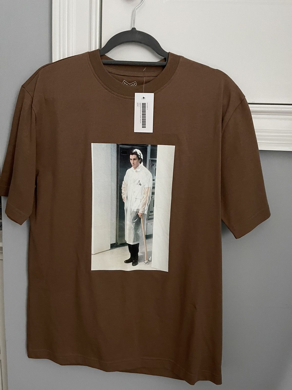 image of Palace “Patrick Bateman/american Psycho” Tshirt in Brown, Men's (Size Medium)
