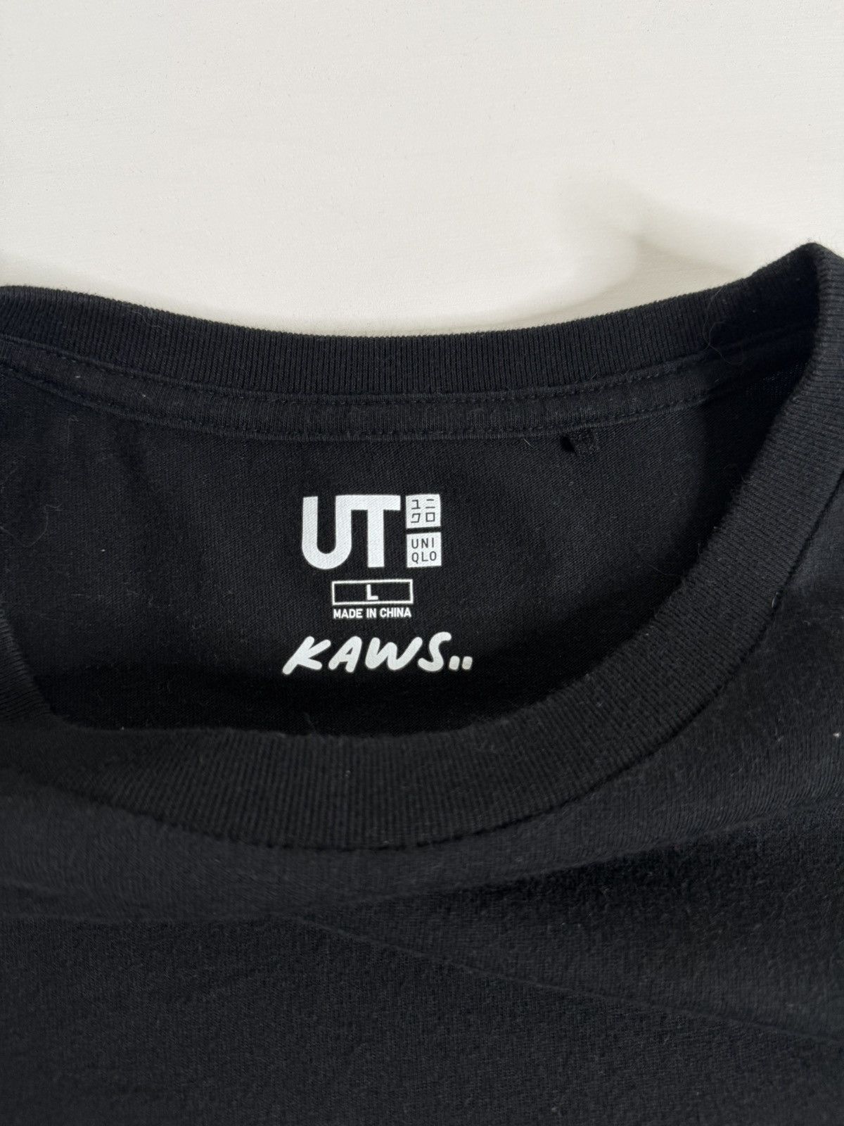 Kaws KAWS Pocket Graphic Tee "Black" (L) *PREOWNED* Size US L / EU 52-54 / 3 - 6 Thumbnail