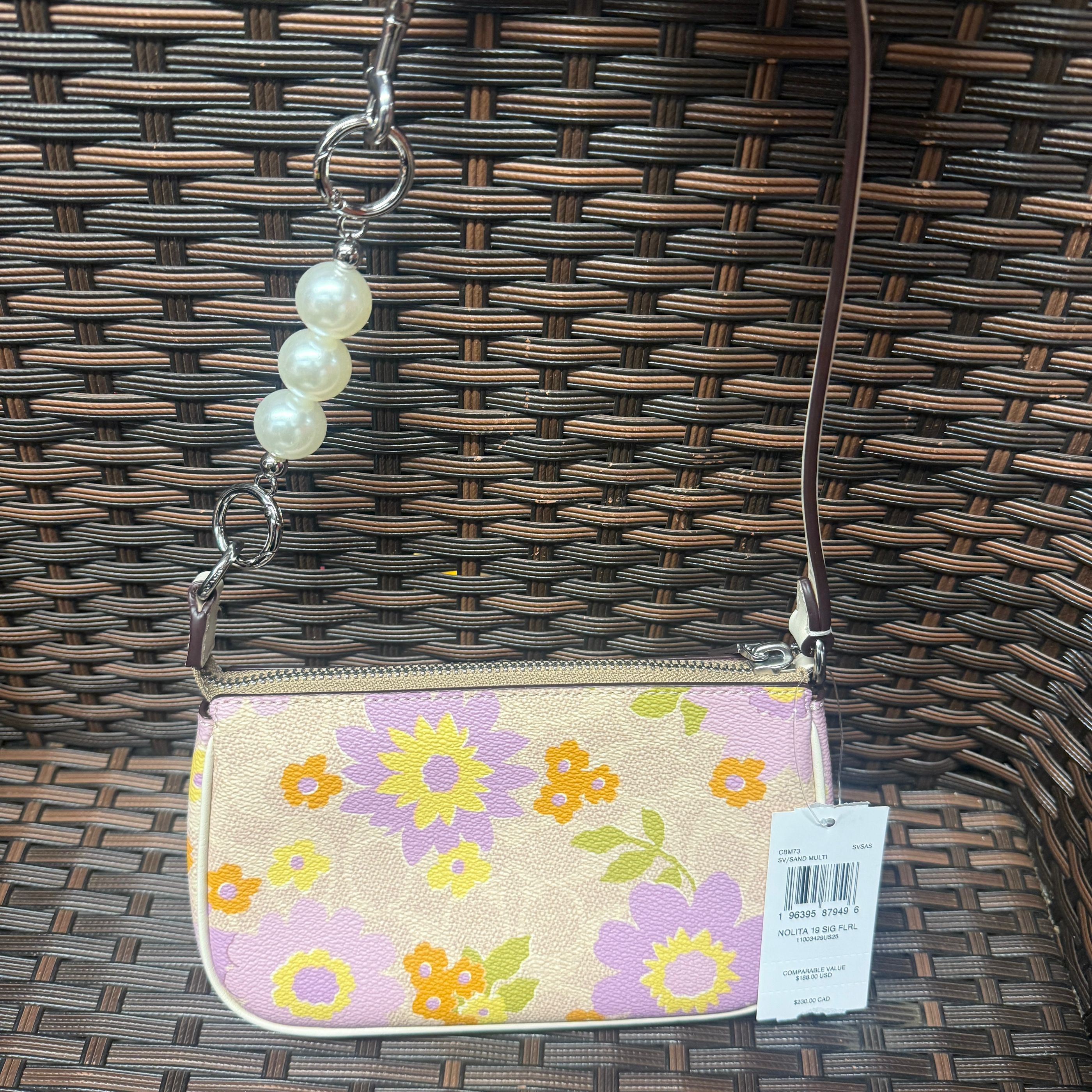 coach Nolita 19 In Signature Canvas With Floral Print cbm73