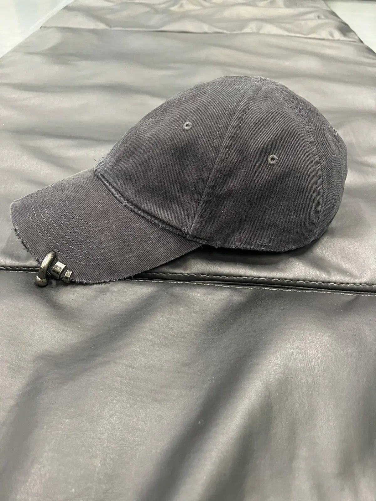 image of Balenciaga Heavy Piercing Cap in Black, Men's