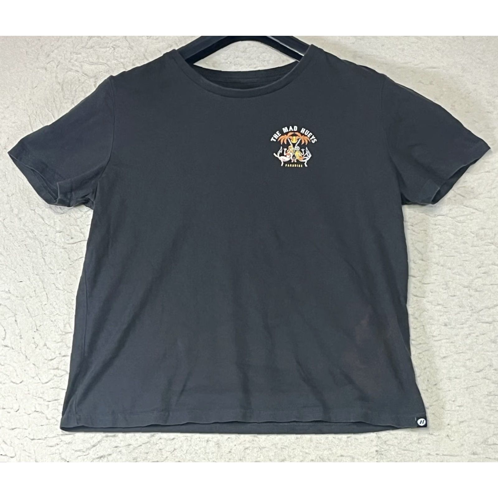 Vintage The Mad Hueys T-Shirt Black Graphic Print What Happens In Paradise Medium Mens Reg Crew Neck Short Sleeve Cotton Graphic Print Size US M / EU 48-50 / 2 - 2 Thumbnail