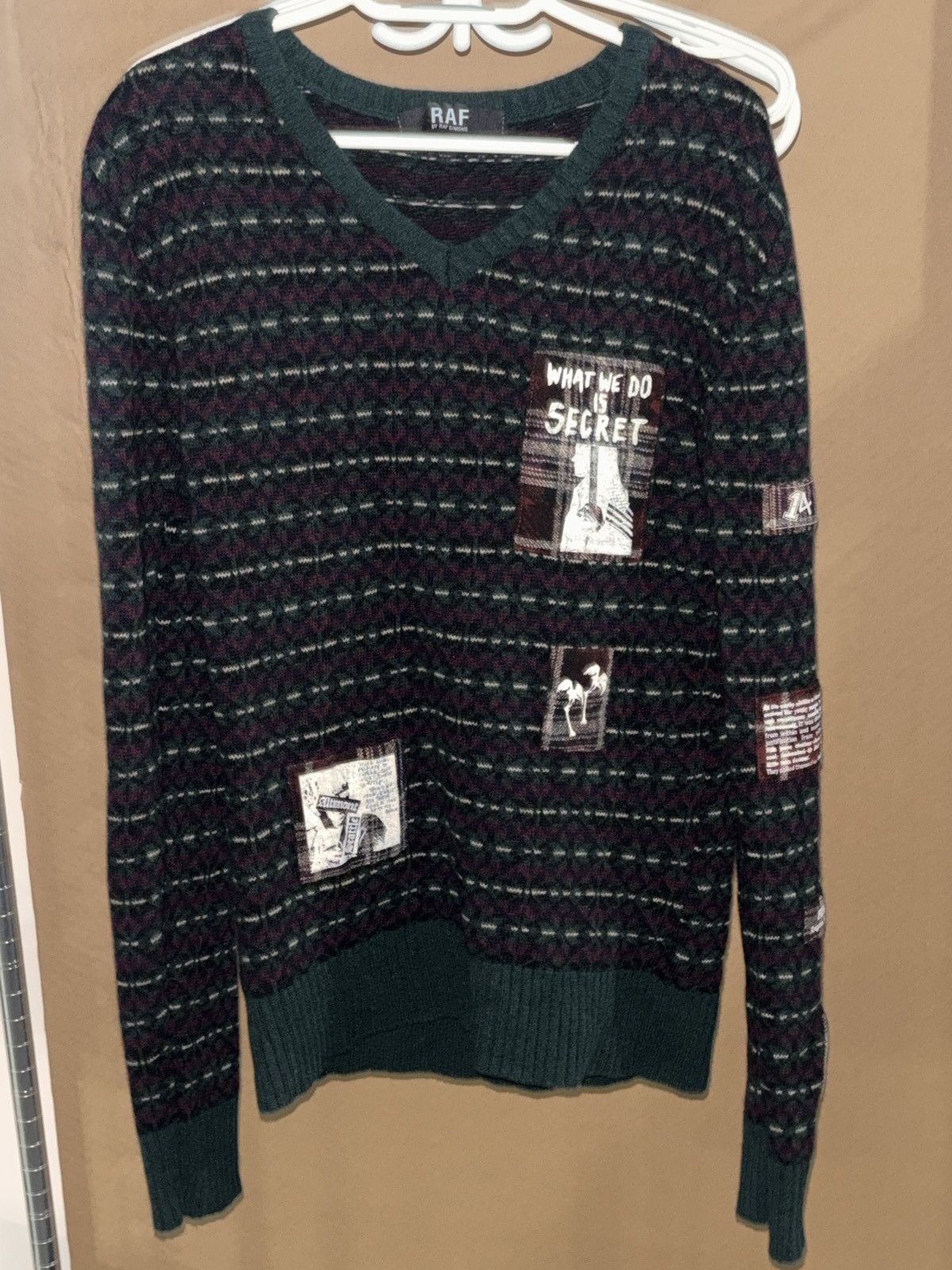 RAF Simons “what we do is secret” sweater