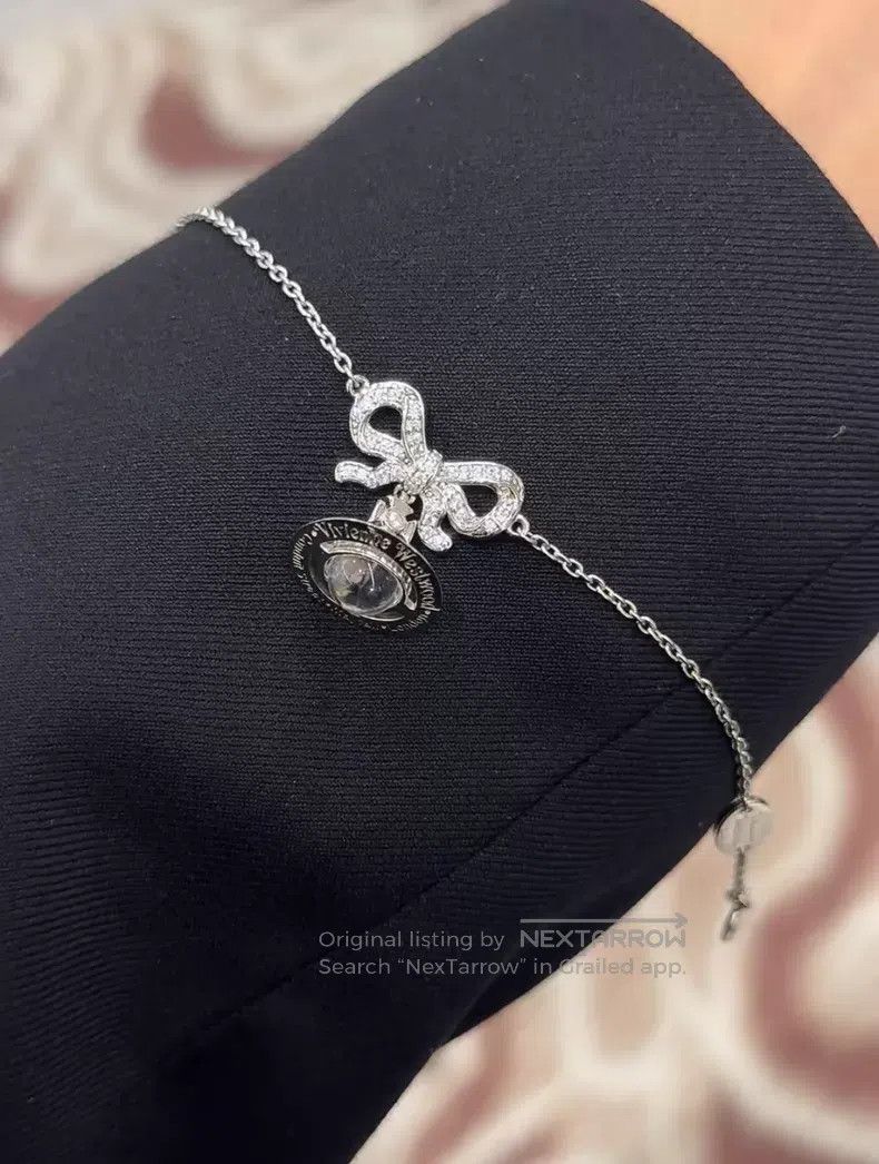 Vivienne Westwood Vivienne Westwood Bow-tie transparent orb, pure silver, br Size ONE SIZE - 1 Thumbnail