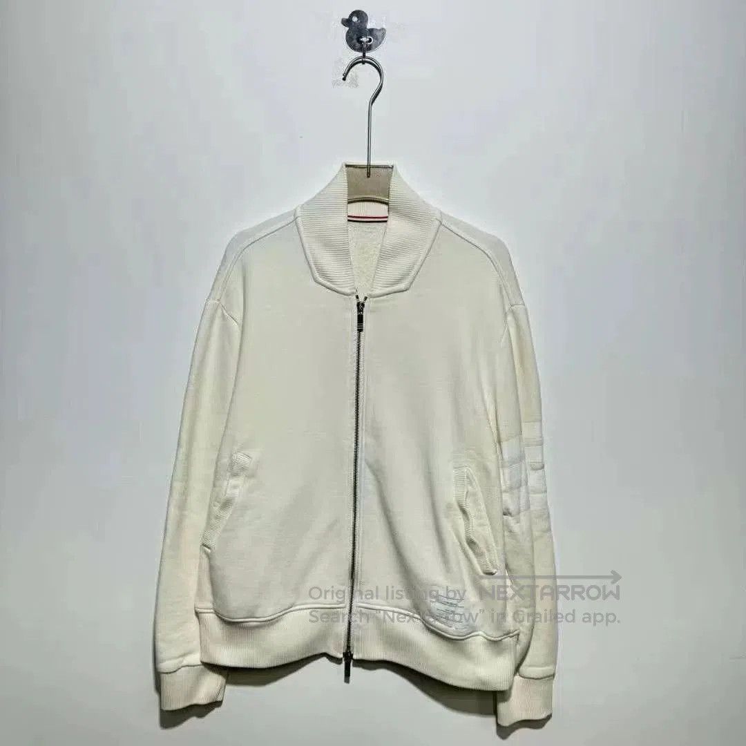 thom browne beige zip jacket with stripes.