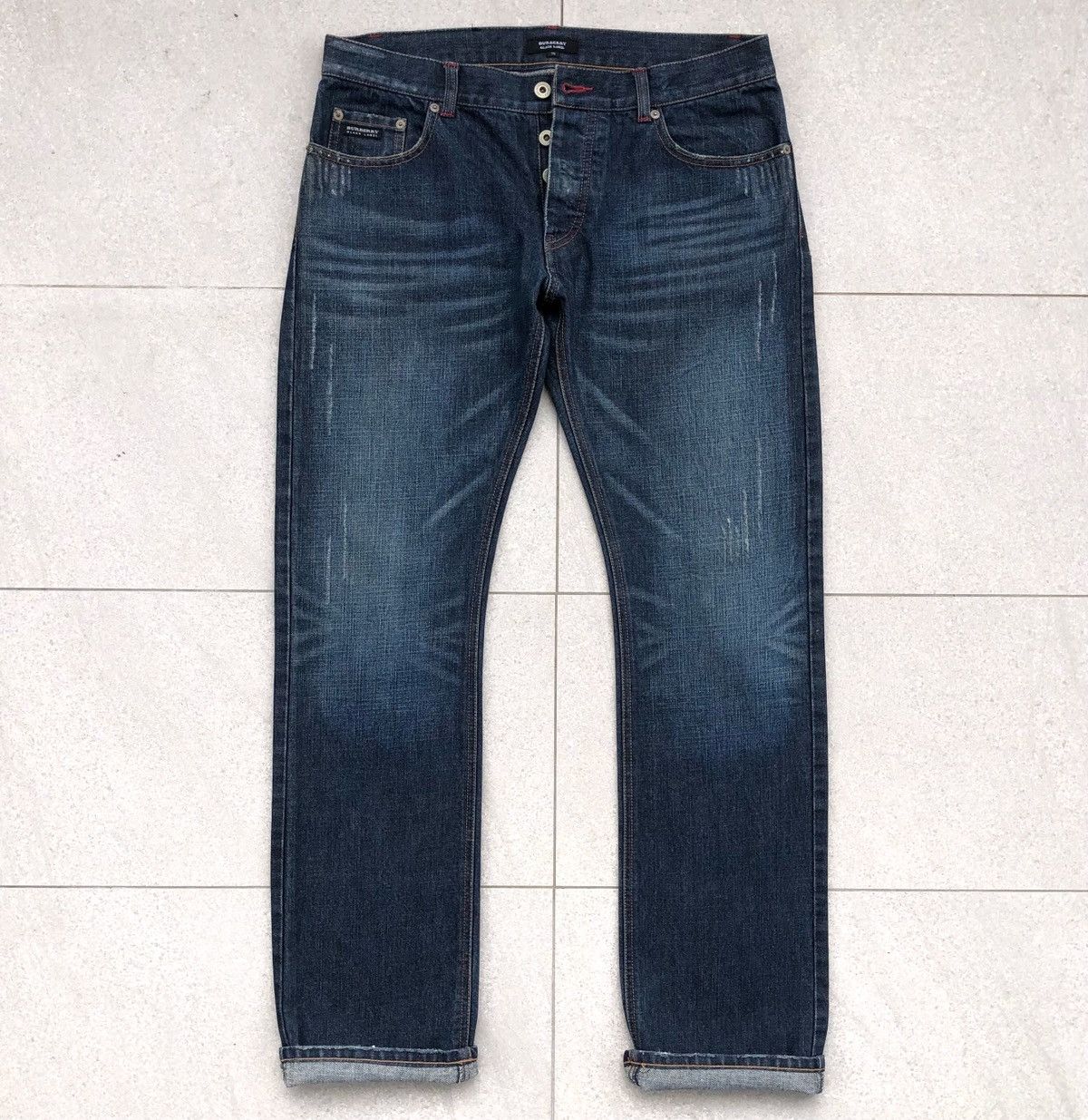 image of Burberry Black Label Distressed Reconstructed Jeans in Blue Denim, Men's (Size 33)