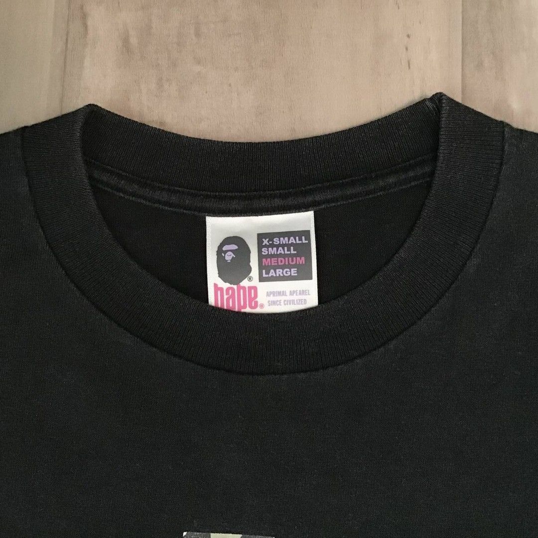 Bape × Kaws BAPE × KAWS 1st camo green bendy NYC college logo T-shirt Size US M / EU 48-50 / 2 - 7 Thumbnail