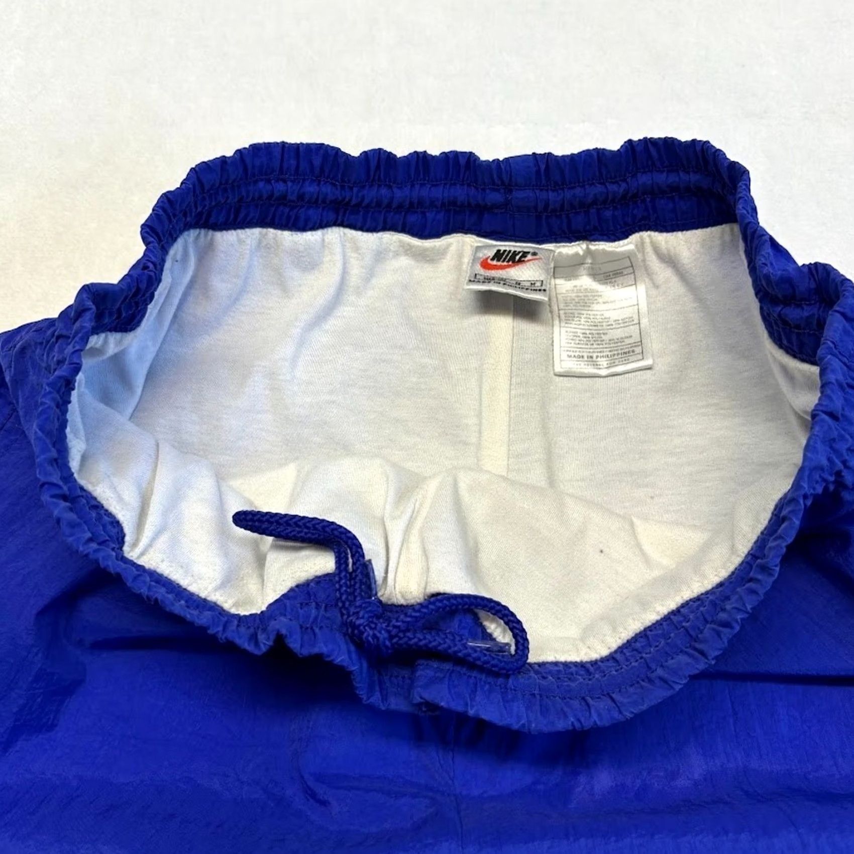 Nike VINTAGE Nike Track Pants M Blue Nylon Windbreaker Ankle Zip Embroidered Swoosh Size US 31 - 3 Thumbnail