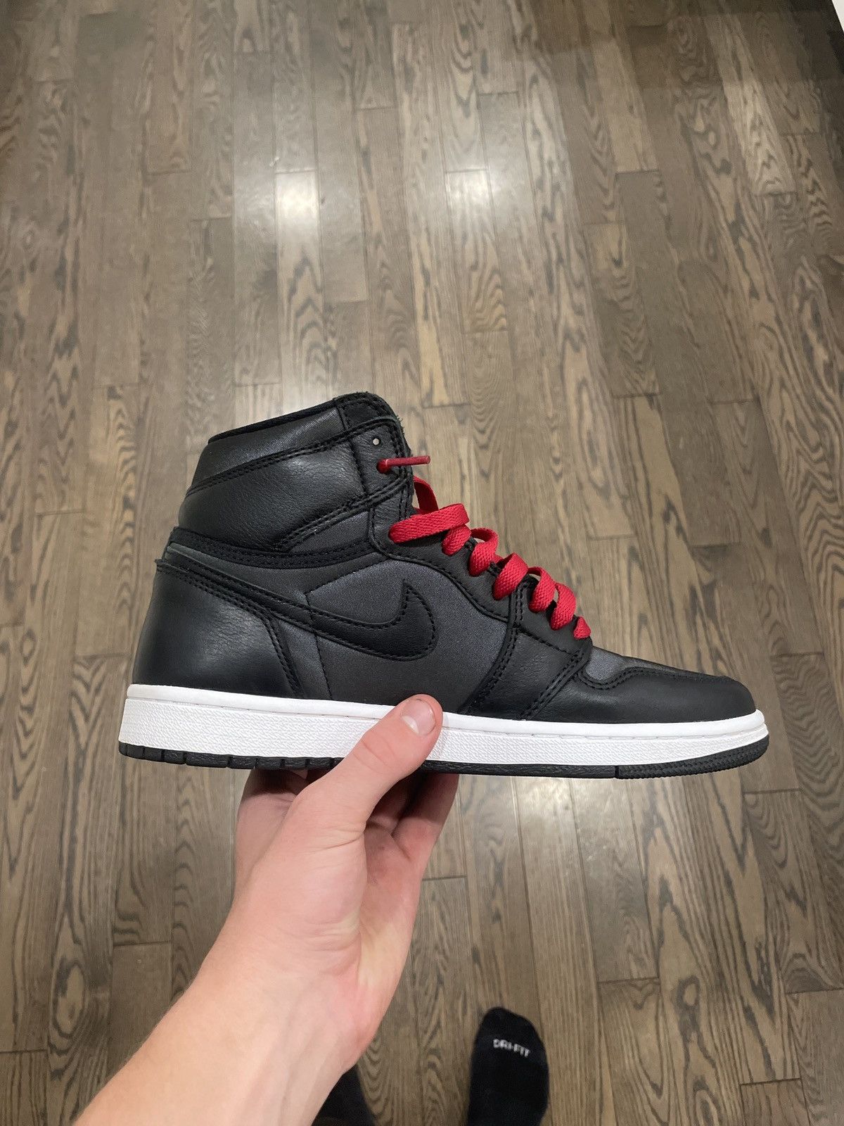 half black half red jordan ones