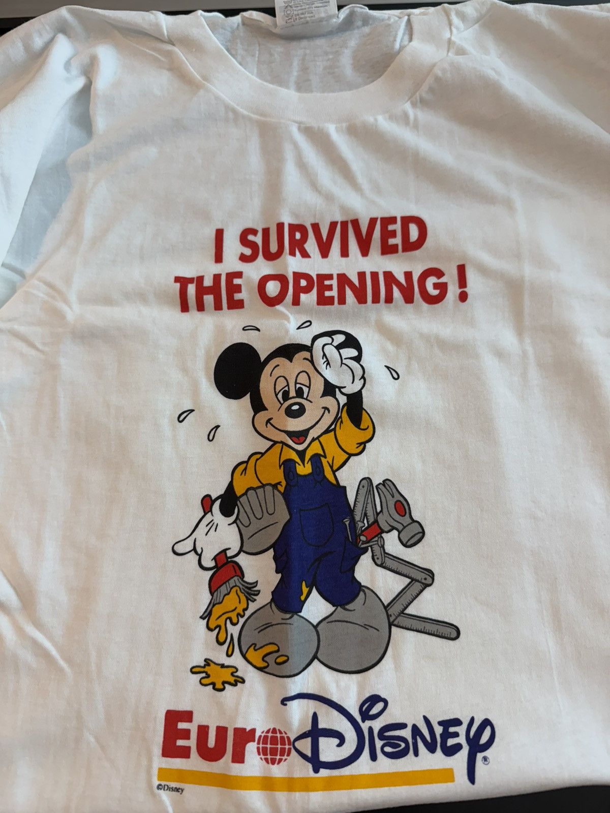 Disney RARE 1994 Euro Disney “I Survived The Opening!” NWT Size US XL / EU 56 / 4 - 1 Thumbnail