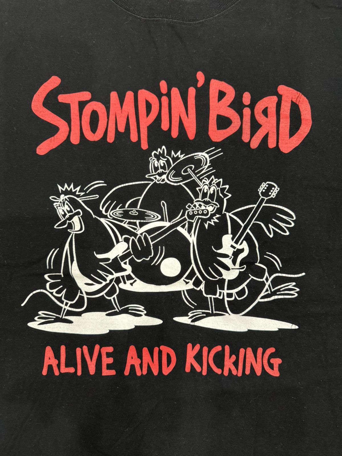 Band Tees Stompin’ Bird, Alive and Kicking black Shirt L size Size US L / EU 52-54 / 3 - 4 Thumbnail