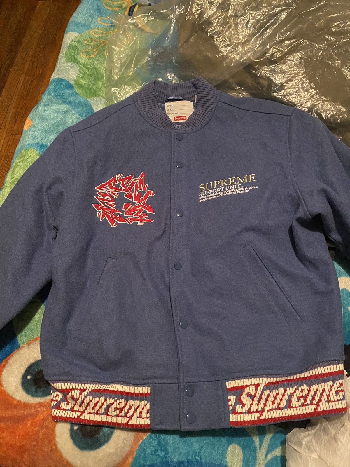 Supreme Supreme support unit varsity jacket | Grailed