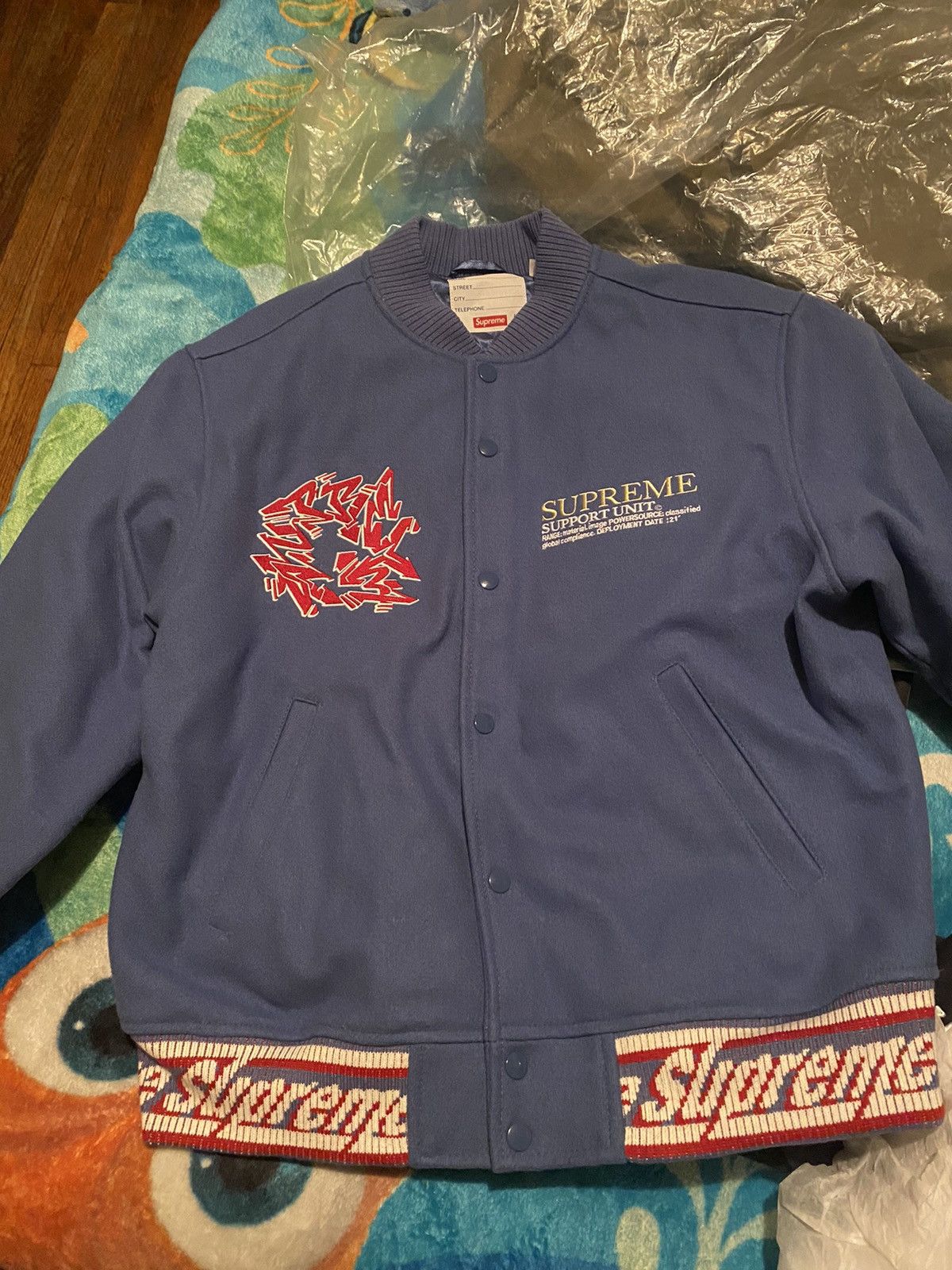 Supreme Supreme support unit varsity jacket Grailed