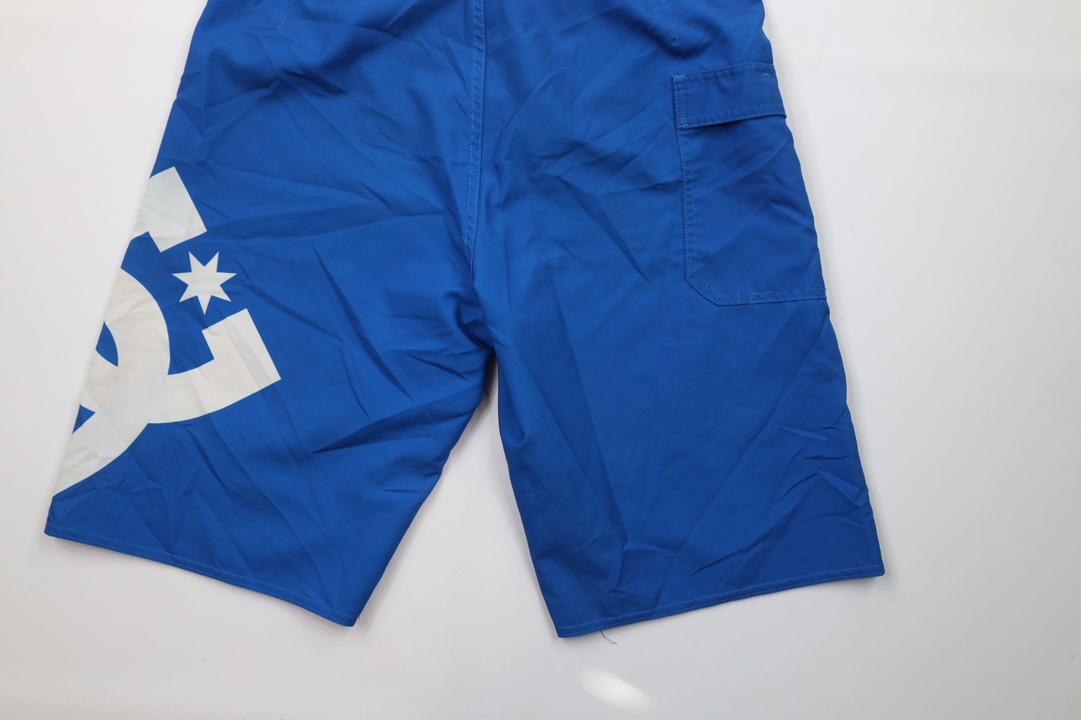 Vintage Vintage DC Shoes Big Logo Skateboarding Board Shorts Blue Size US 32 / EU 48 - 11 Thumbnail