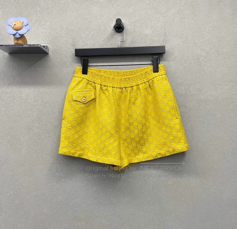 Gucci Yellow logo shorts
