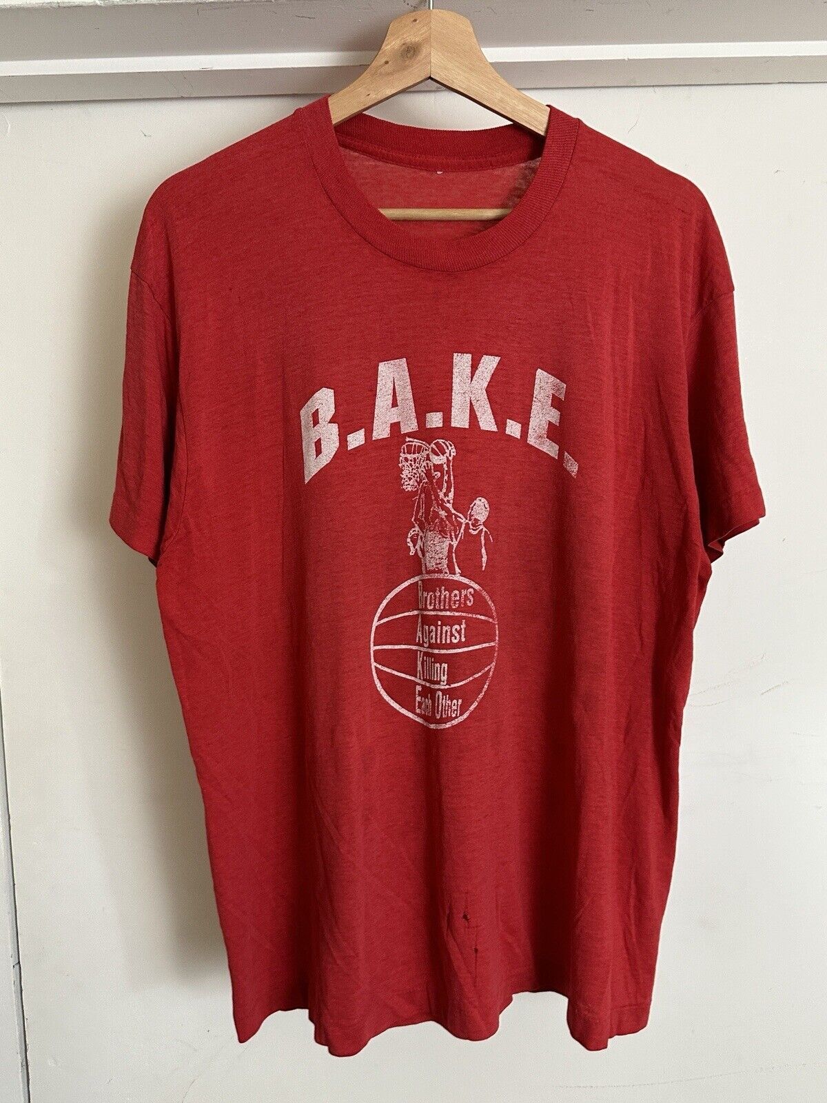 image of Vintage VTG 80's B.a.k.e. Brother Against Killing T-Shirt Size Xs Bball in Red, Men's