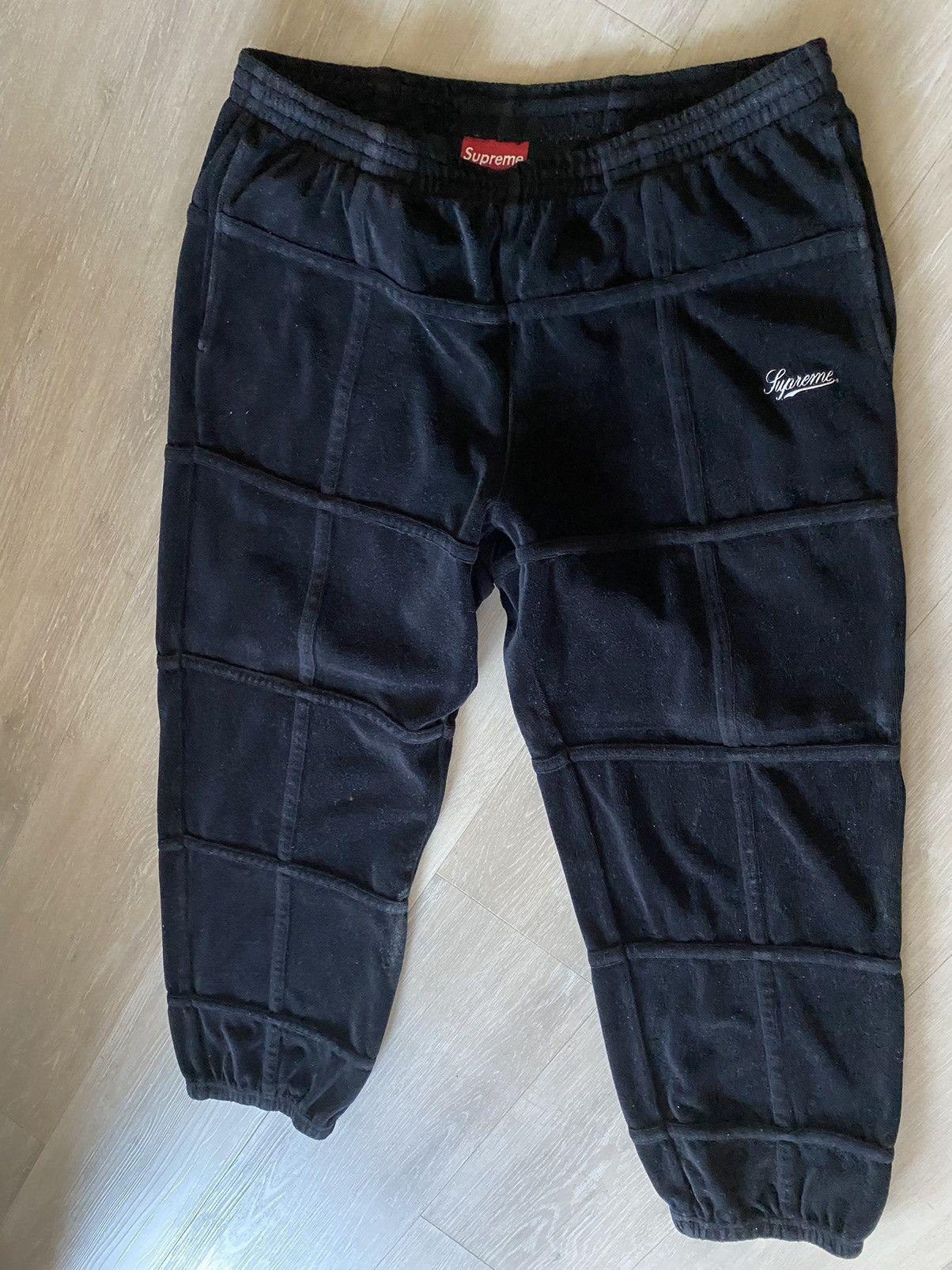 Supreme Supreme grid taping velour track pants in black size ...