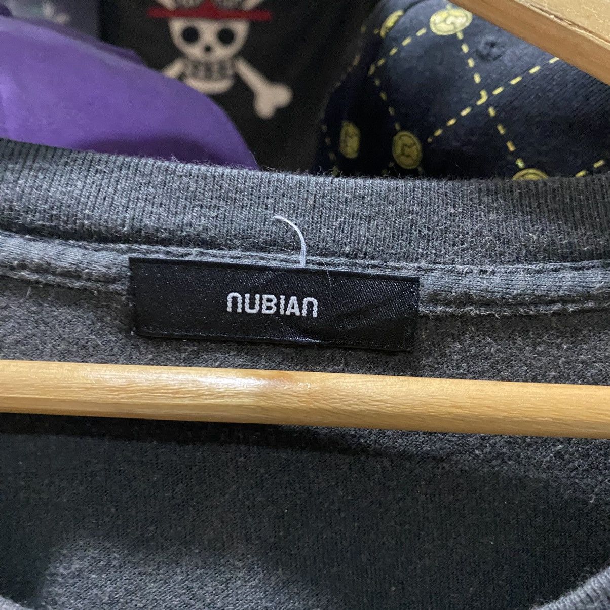 NUBIAN Nubian (N)WO W(U)TANG PU(B)LIC ENEMY B(I)G TUP(A)C (N)AS RAP Size US XL / EU 56 / 4 - 8 Thumbnail