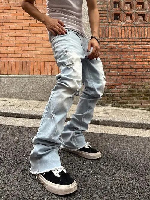 Flared distressed stacked denim jeans slim