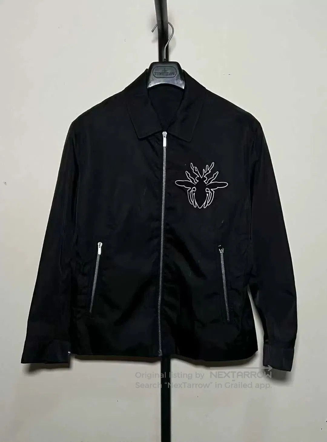 black embroidered logo bee zip jacket.