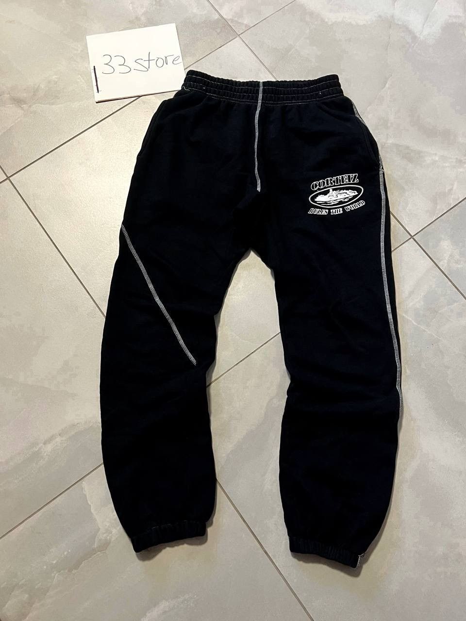 Corteiz CORTEIZ ISLAND PUFF PRINT OPEN HEM PANT [BLACK] | Grailed