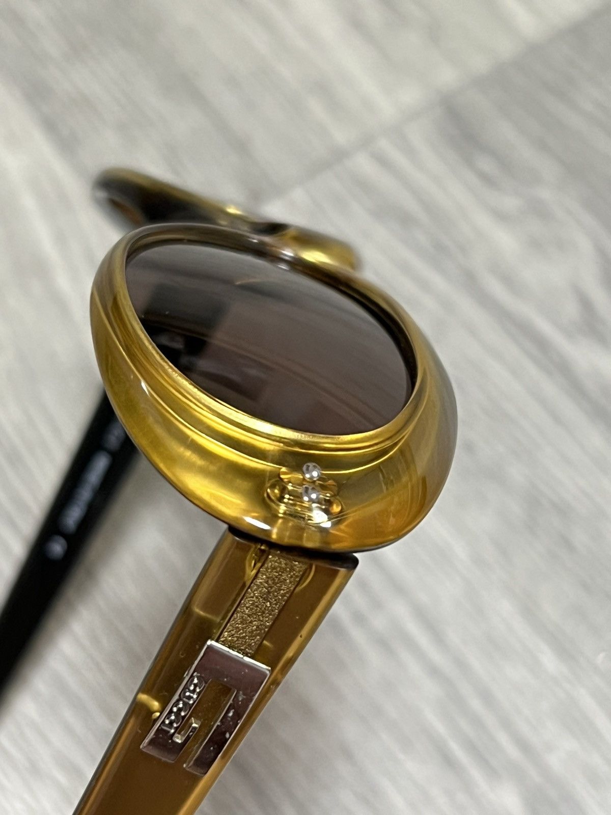 Vintage Gucci Vintage gold sunglasses with black inner temples Size ONE SIZE - 12 Thumbnail