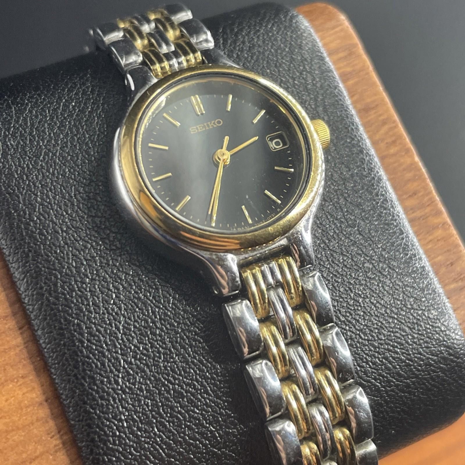 Seiko Seiko 7N82-0228 Day Silver Tone Gold Accents New Battery Size ONE SIZE - 1 Thumbnail