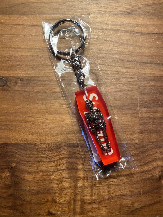 Supreme skeleton hot sale keychain red