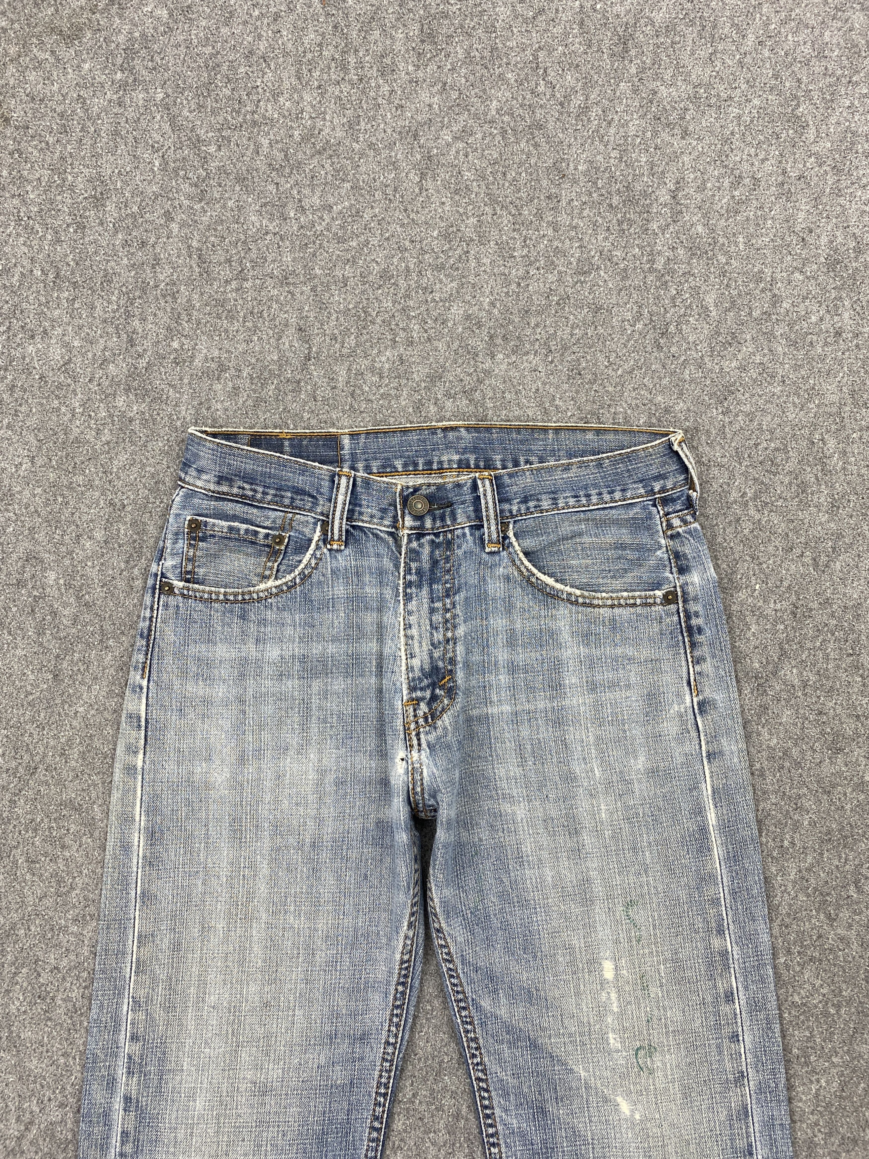 Distressed Vintage Levi's 505 Faded Blue Jeans