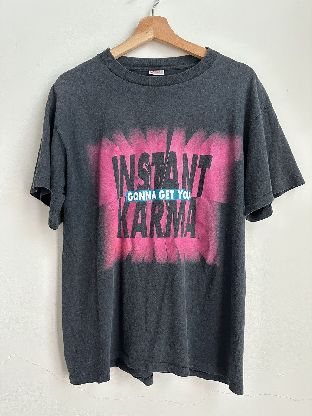 Instant karma clearance nike t shirt