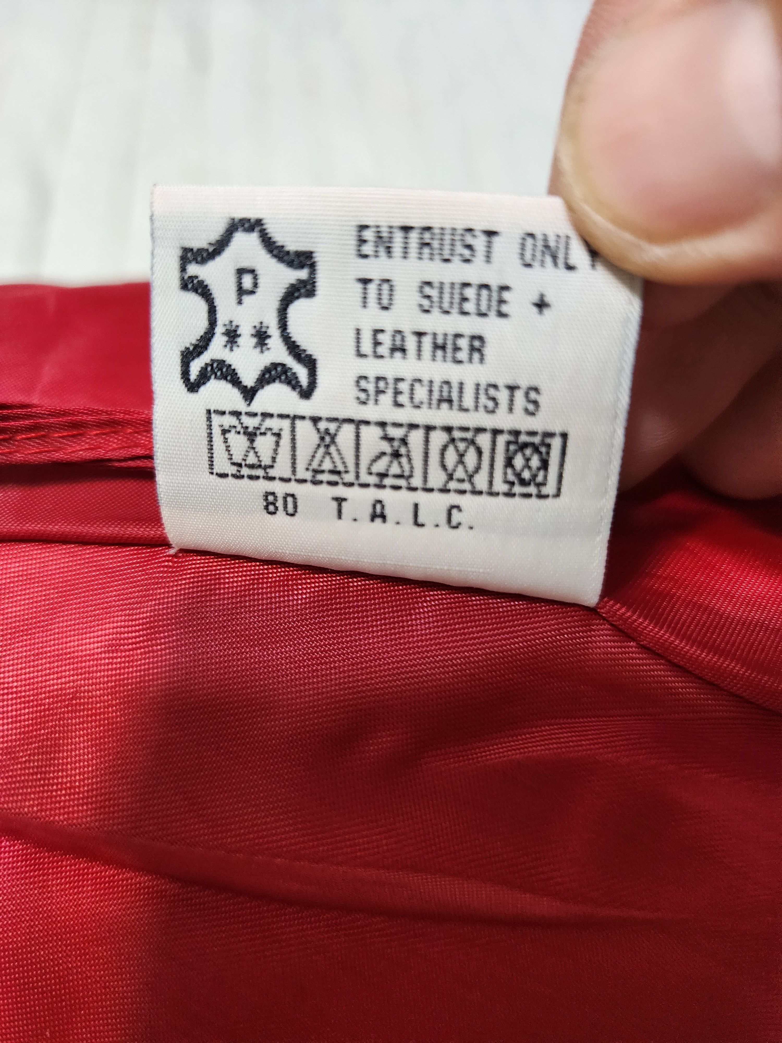Red skirt made of genuine suede with perforation.