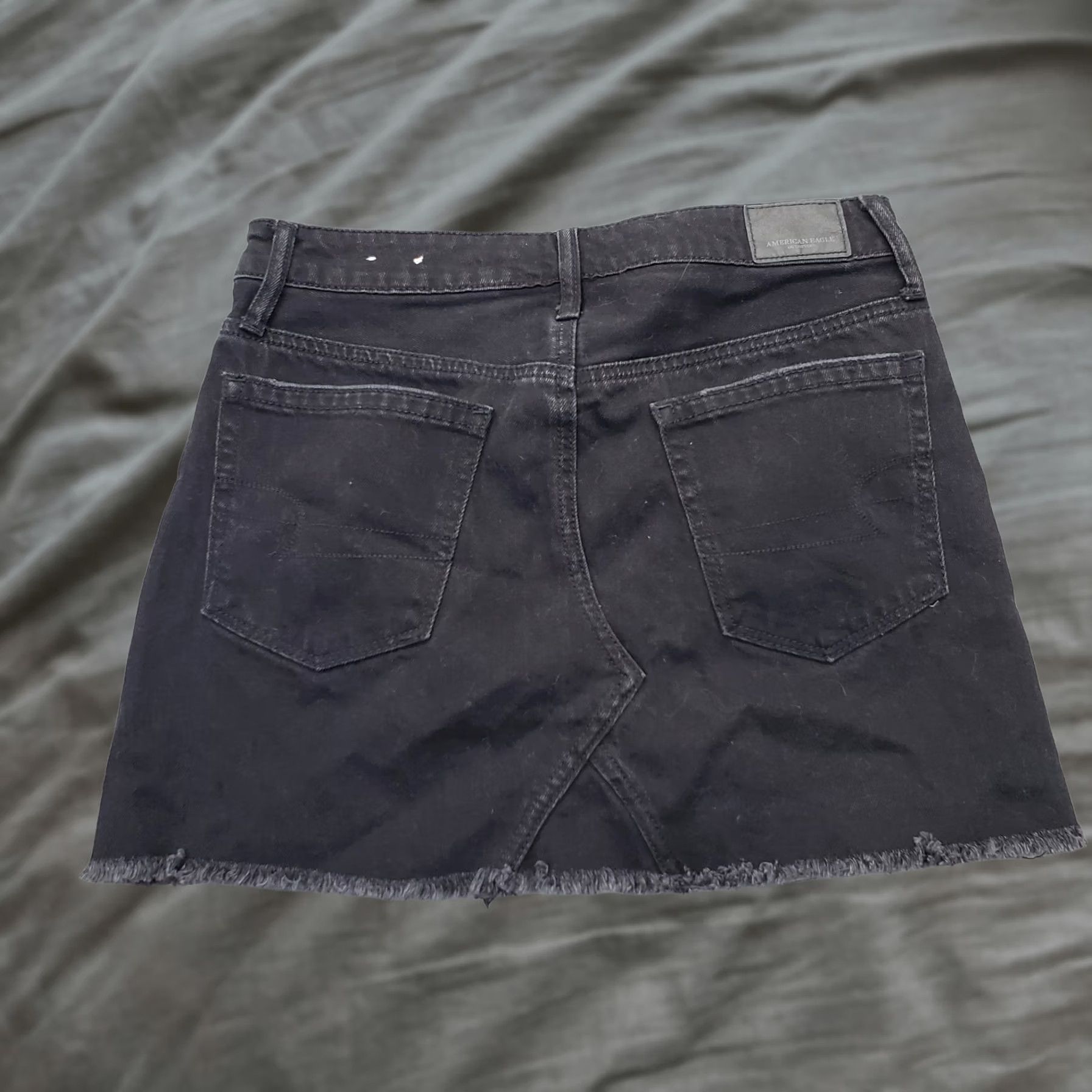 American Eagle Outfitters American Eagle Outfitters Denim Mini Skirt Womens Size 0 Black Button Fly Raw Hem Mini Skirt Womens Black Denim Short Size 25" / US 0 / IT 36 - 1 Thumbnail