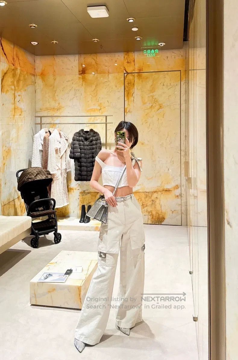 Fendi Fendi The woman is wearing beige wide-leg pants. Size 27" / US 4 / IT 40 - 5 Thumbnail