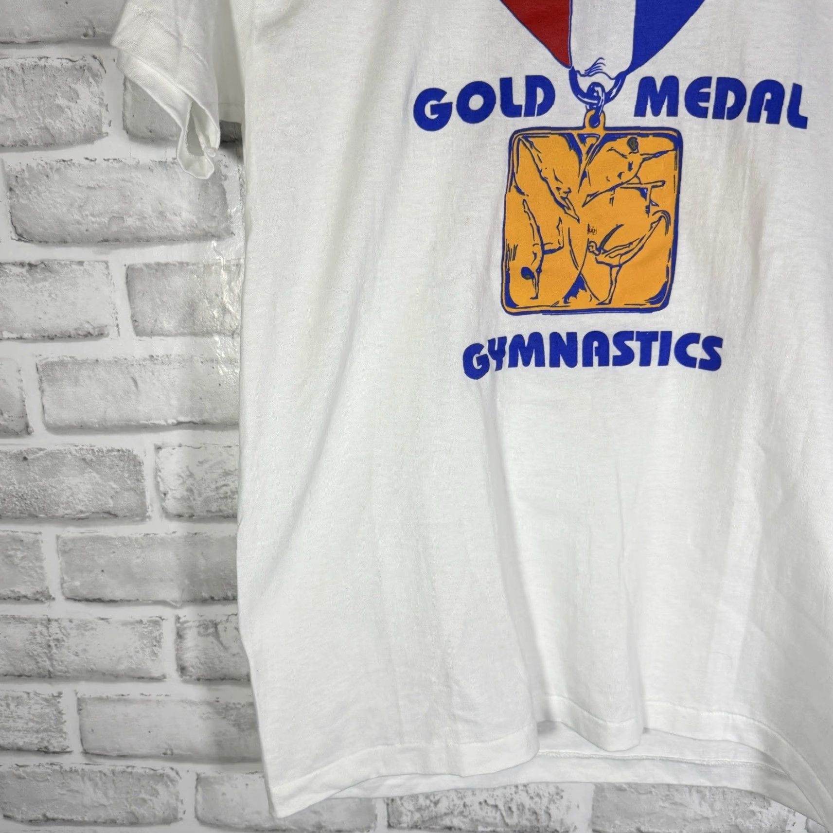 Hanes VINTAGE Hanes Gymnastics Gold Medal Graphic Tee Mens M USA White Stitch USA 1990s? (no extra) Size US M / EU 48-50 / 2 - 3 Thumbnail