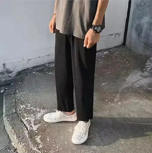 Black pleated trousers